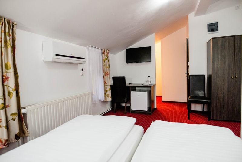 Gazde/Camere de închiriat Pensiunea Casa Helis